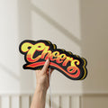 Unlit Cheers LED lightbox held by hand to show size and details