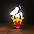 Front view of Donald LED lightbox sign glowing on a wooden desk