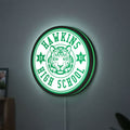 Hawkins Stranger Things LED lightbox hanging on a wall with green glow