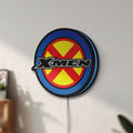 Unlit X-Men LED lightbox mounted on a wall in daylight