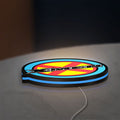 X-Men LED lightbox lying flat on a desk with blue glow