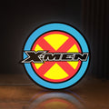 Front view of X-Men LED lightbox sign glowing on a wooden desk