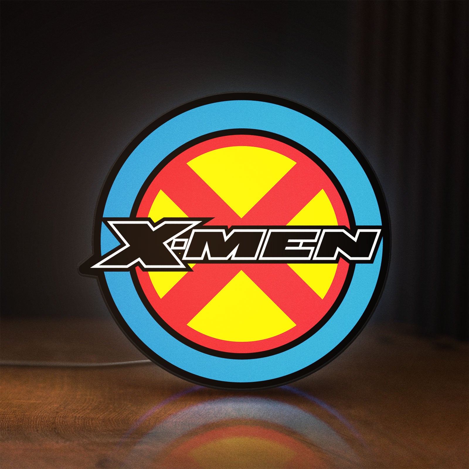 Front view of X-Men LED lightbox sign glowing on a wooden desk