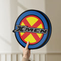 Unlit X-Men LED lightbox held by hand to show size and details