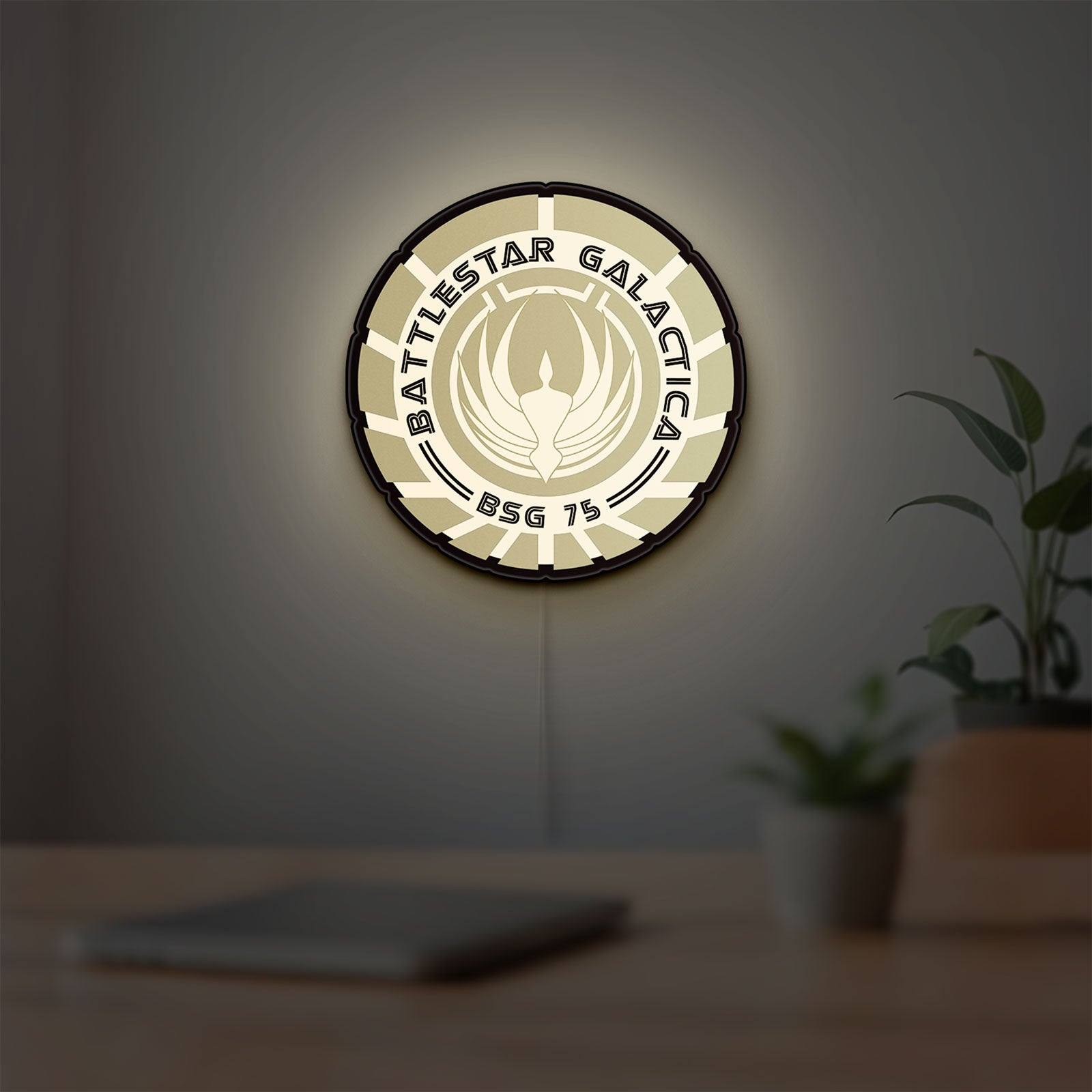 Battlestar Galactica Colonial Emblem LED lightbox hanging on a room wall with soft white light