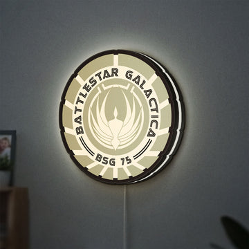 Battlestar Galactica Colonial Emblem LED lightbox hanging on a wall with white glow