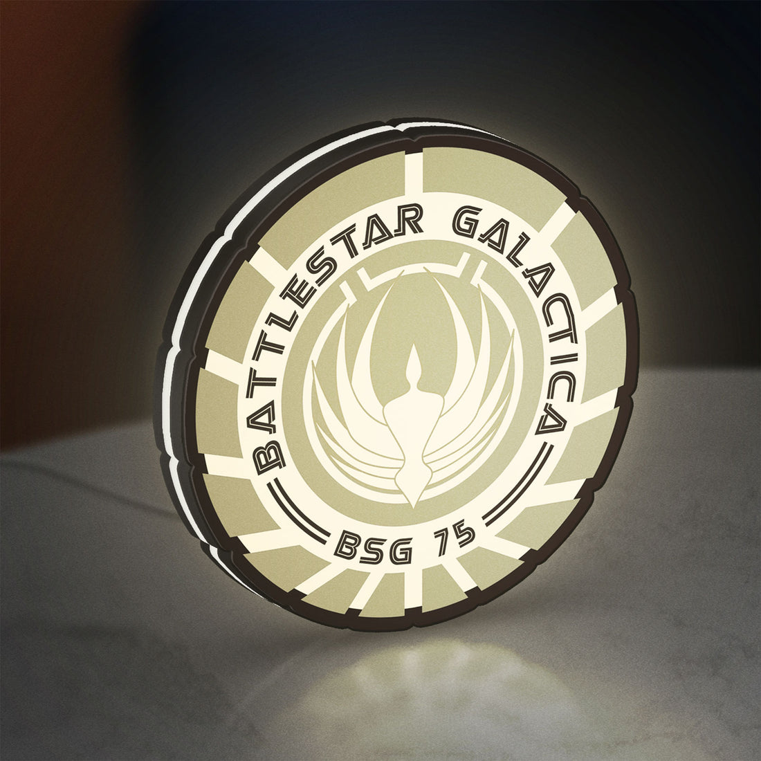 Battlestar Galactica Colonial Emblem LED lightbox hanging on a wall with white glow