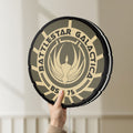 Unlit Battlestar Galactica Colonial Emblem LED lightbox held by hand to show size and details