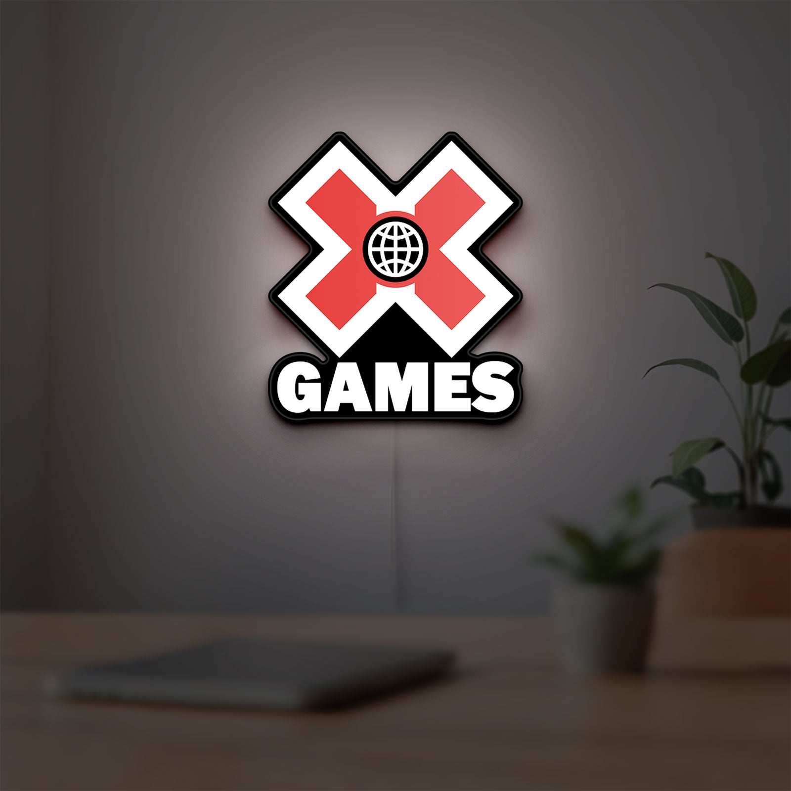 X-Games LED lightbox hanging on a room wall with soft white light