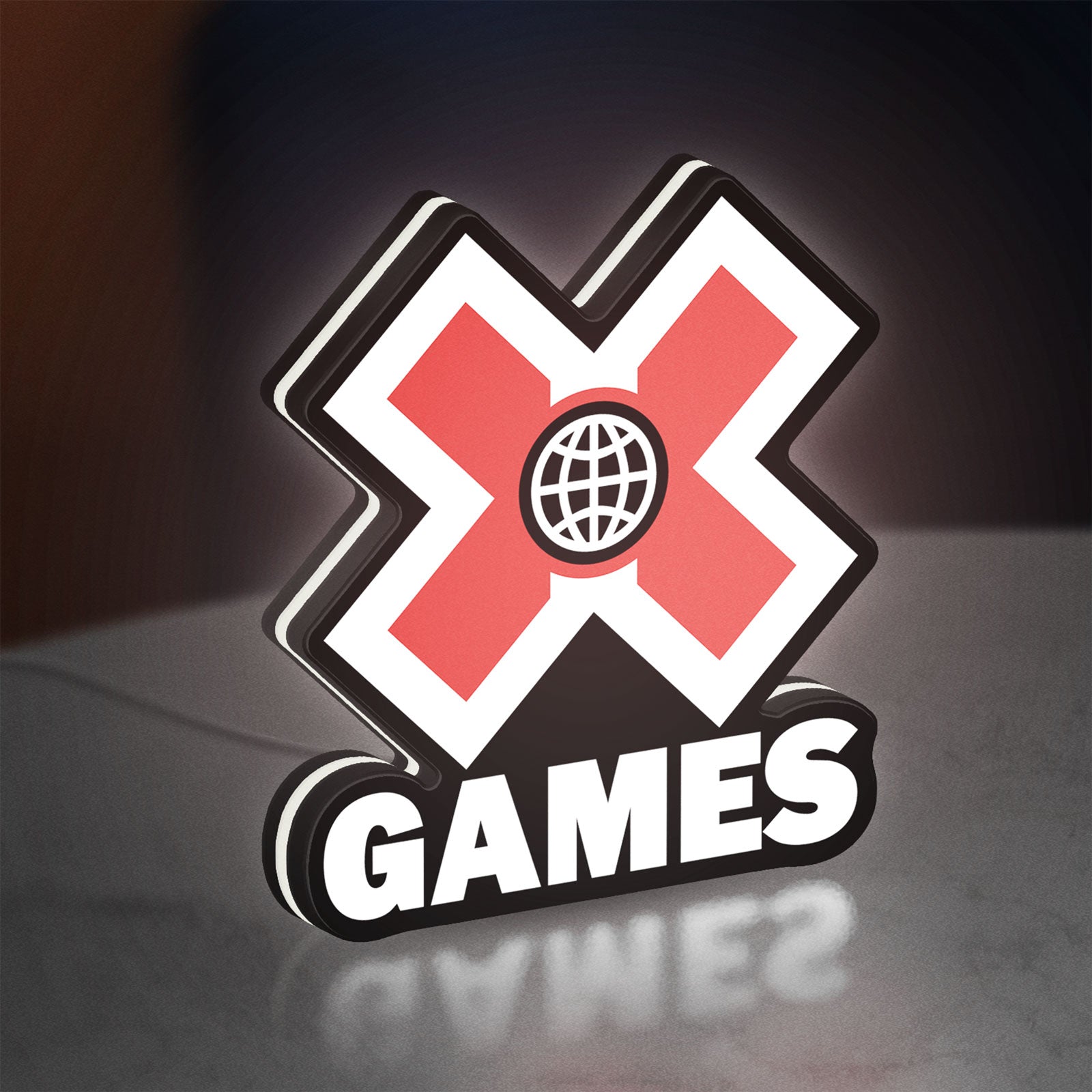 X-Games LED lightbox standing on a desk from an angled side view with white glow