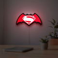 Batman v Superman LED lightbox hanging on a room wall with soft red light