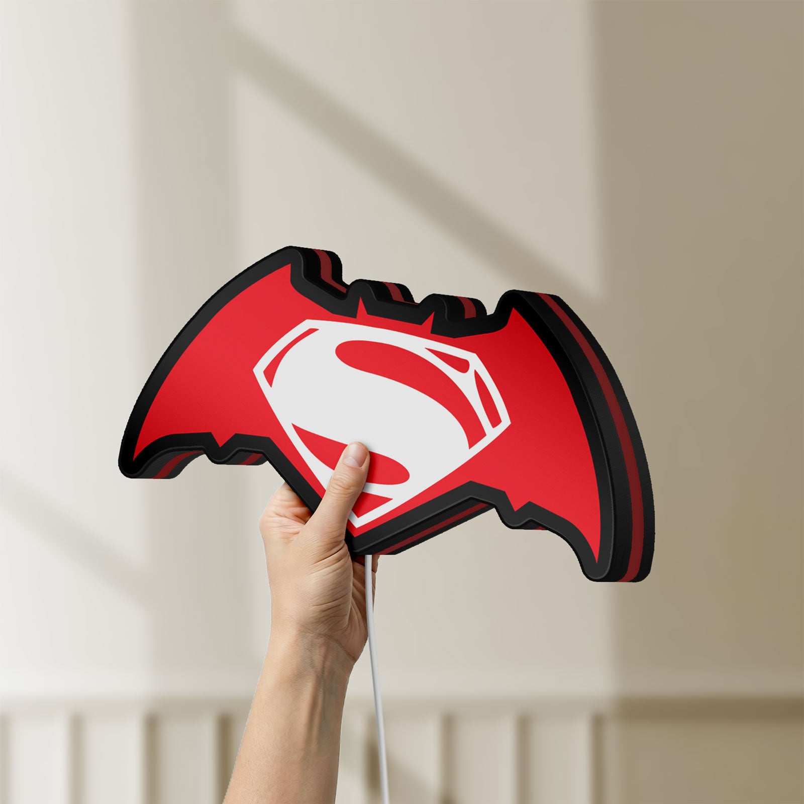 Unlit Batman v Superman LED lightbox held by hand to show size and details