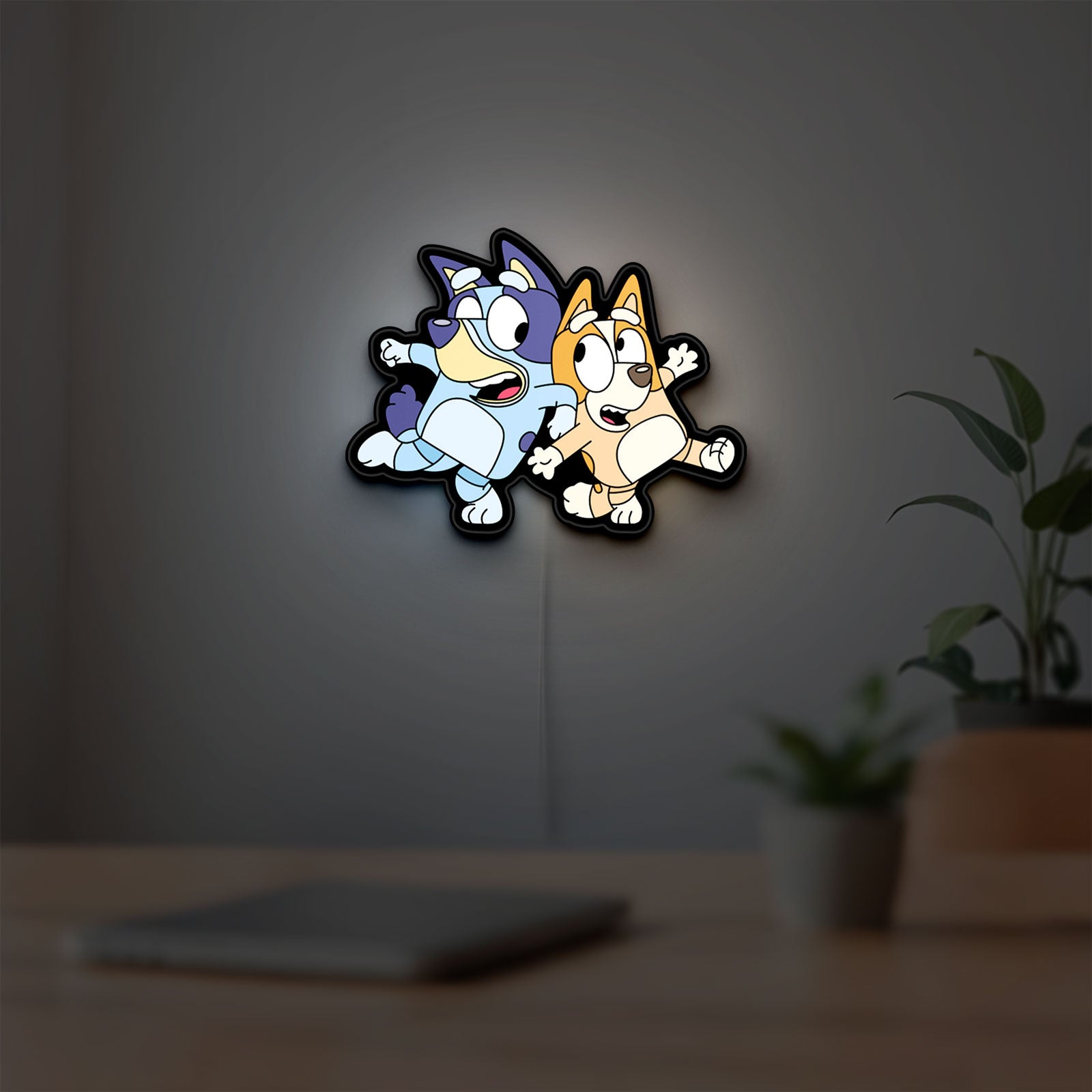 Bluey LED lightbox hanging on a room wall with soft white light