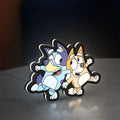 Bluey LED lightbox standing on a desk from an angled side view with white glow