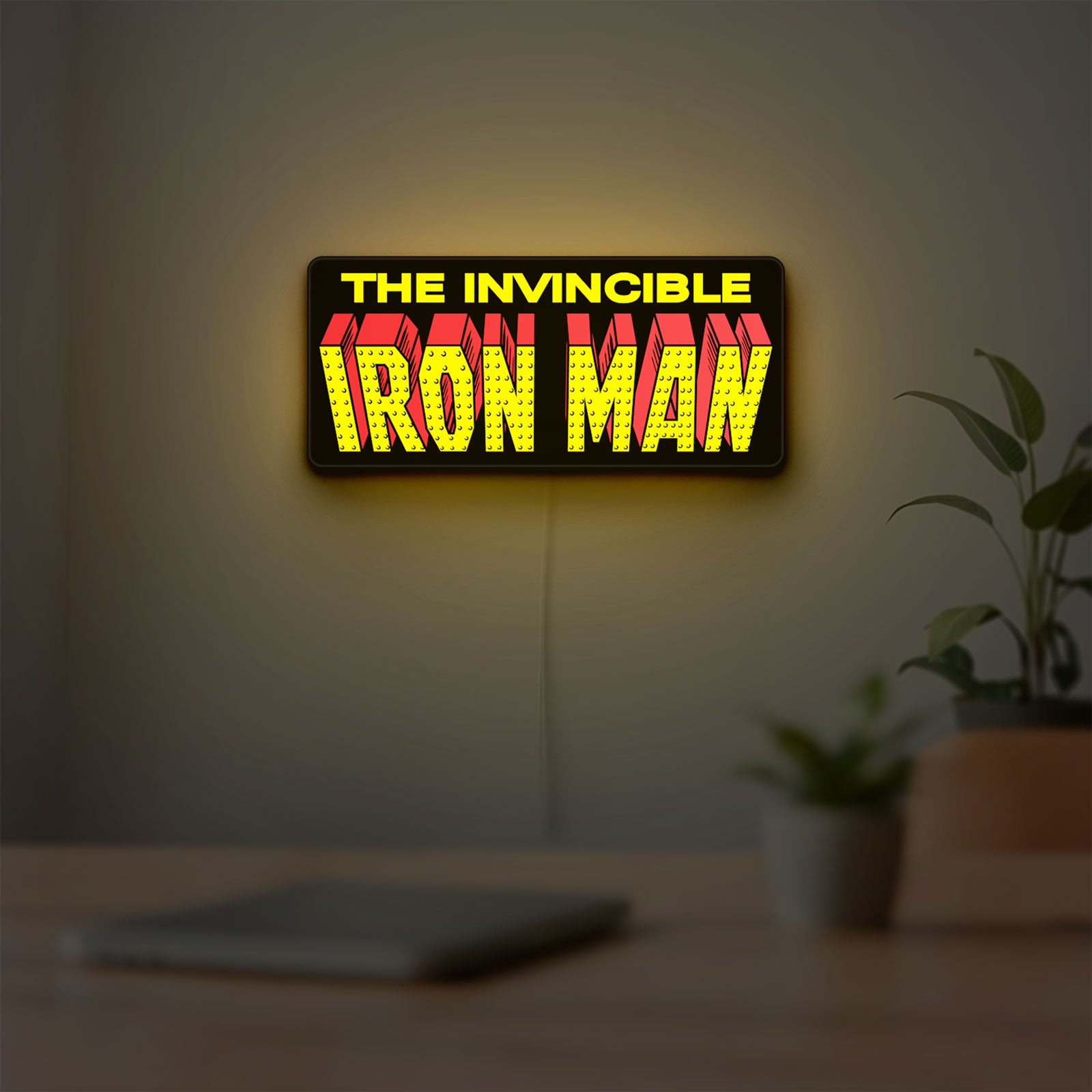 Iron Man Comic Style LED lightbox hanging on a room wall with soft yellow light
