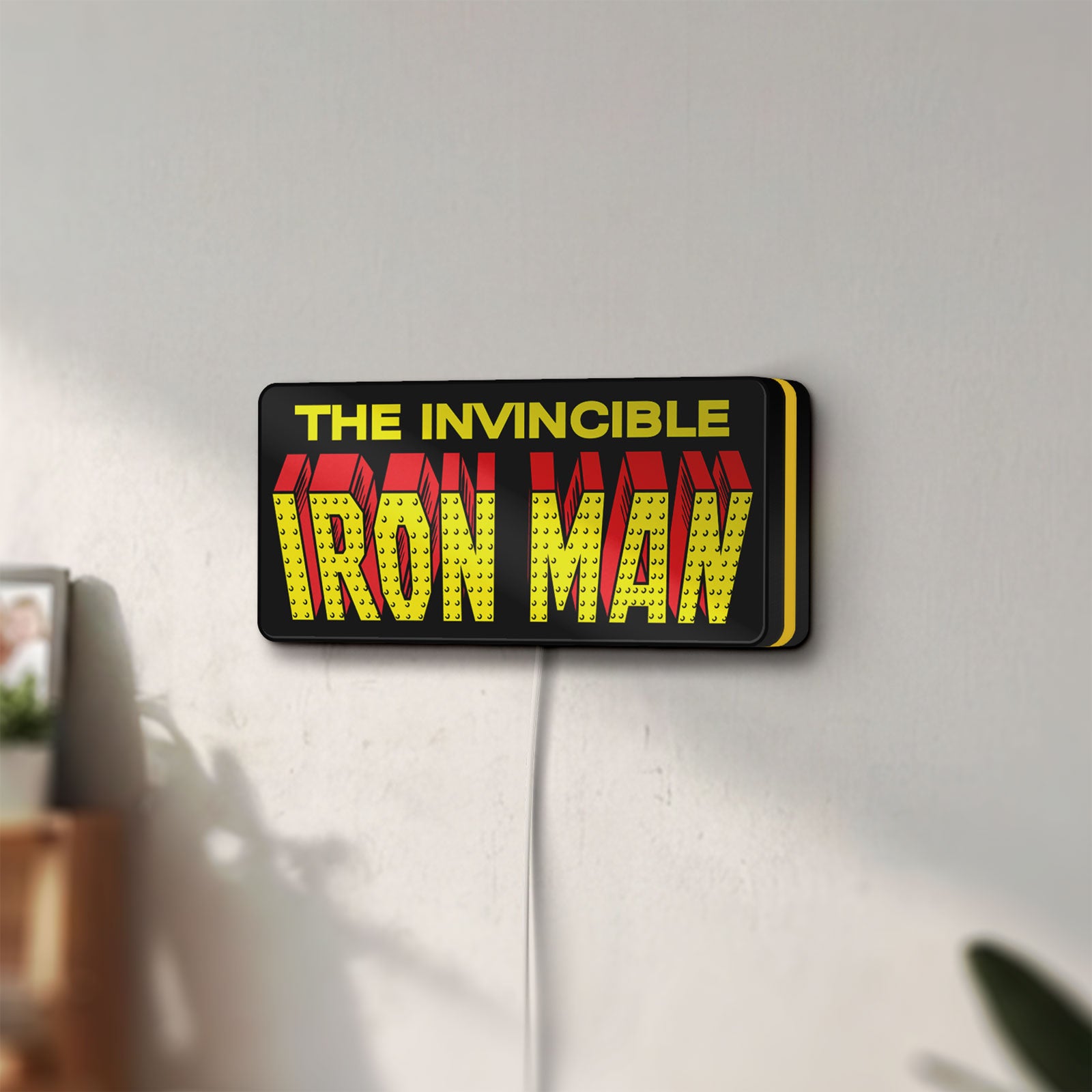 Unlit Iron Man Comic Style LED lightbox mounted on a wall in daylight