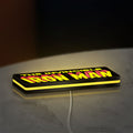 Iron Man Comic Style LED lightbox lying flat on a desk with yellow glow