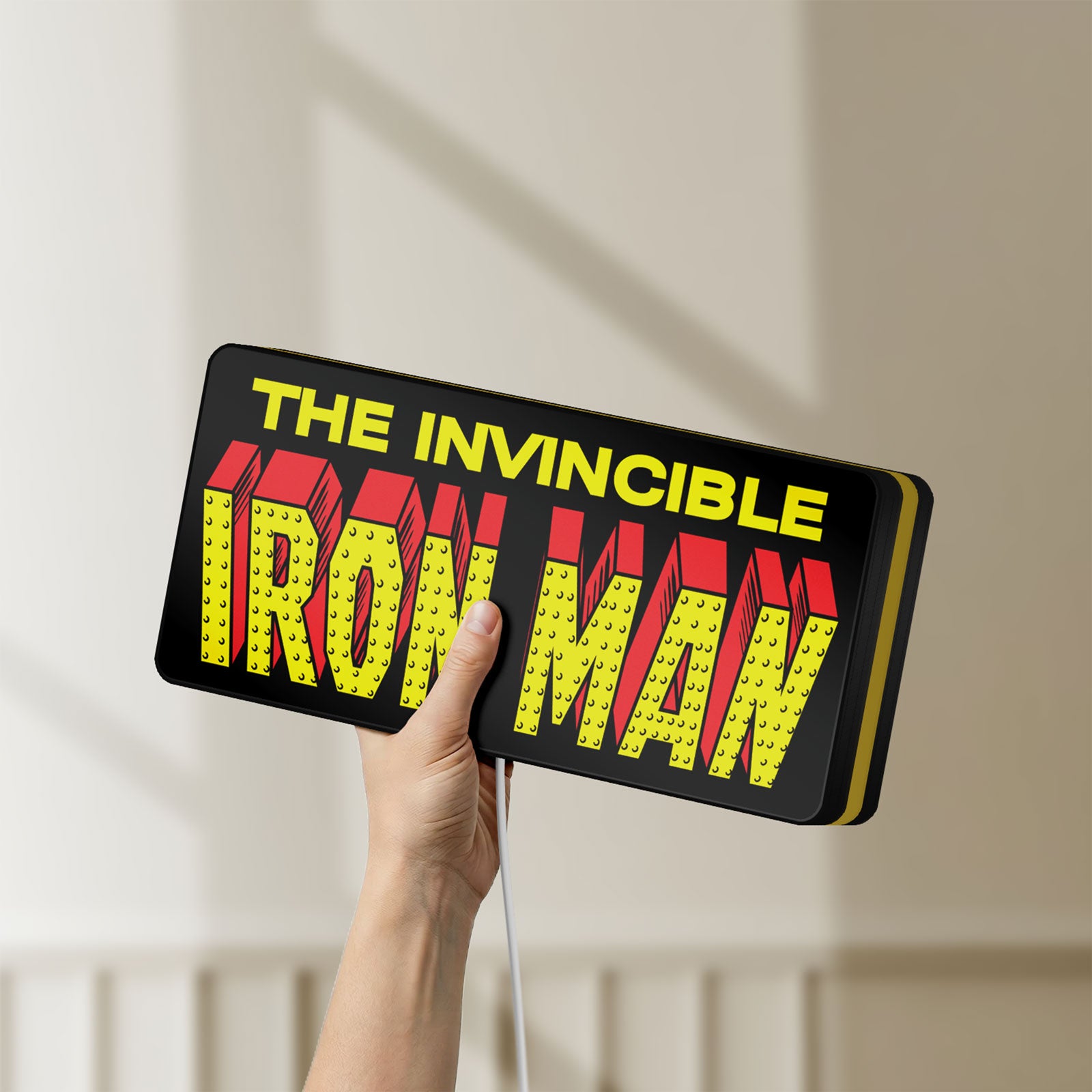 Unlit Iron Man Comic Style LED lightbox held by hand to show size and details