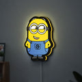 Minions Character LED lightbox hanging on a wall with yellow glow