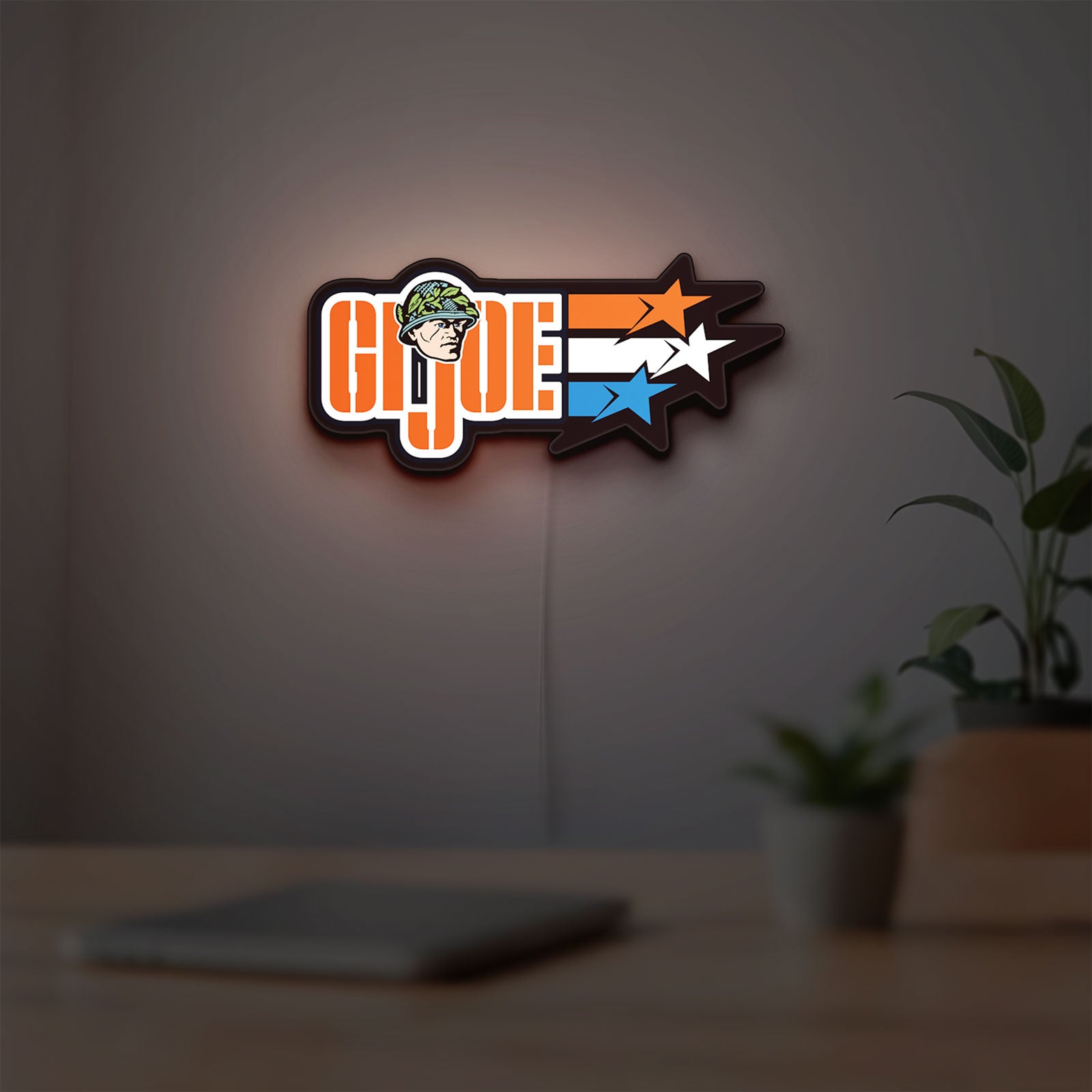 G.I. Joe LED lightbox hanging on a room wall with soft white light