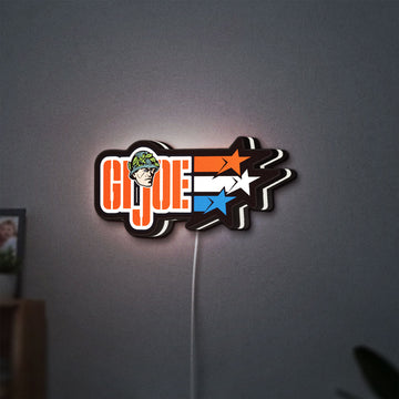 G.I. Joe LED lightbox hanging on a wall with white glow