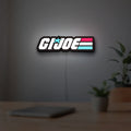 G.I. Joe LED lightbox hanging on a room wall with soft white light