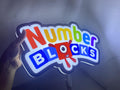 Numberblocks LED Sign (40cm) - Illuminated handheld size reference, unique wall art for desk and room decor