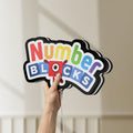 Unlit Numberblocks LED lightbox held by hand to show size and details