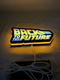 Illuminated flat lay angled view of Back To The Future Delorean Illuminated Sign in 20cm, unique wall art for desk and room decor