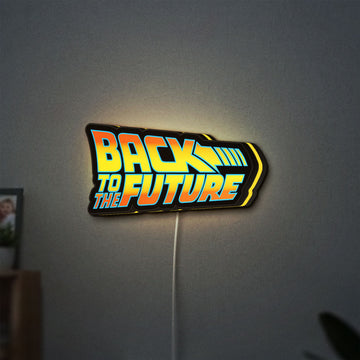 Back to the Future DeLorean LED lightbox hanging on a wall with yellow glow
