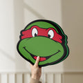 Unlit Teenage Mutant Ninja Turtles LED lightbox held by hand to show size and details