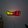 Dragon Ball Z LED lightbox hanging on a wall with yellow glow
