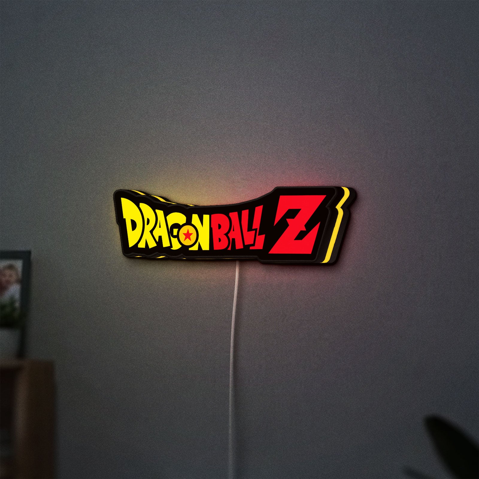 Dragon Ball Z LED lightbox hanging on a wall with yellow glow