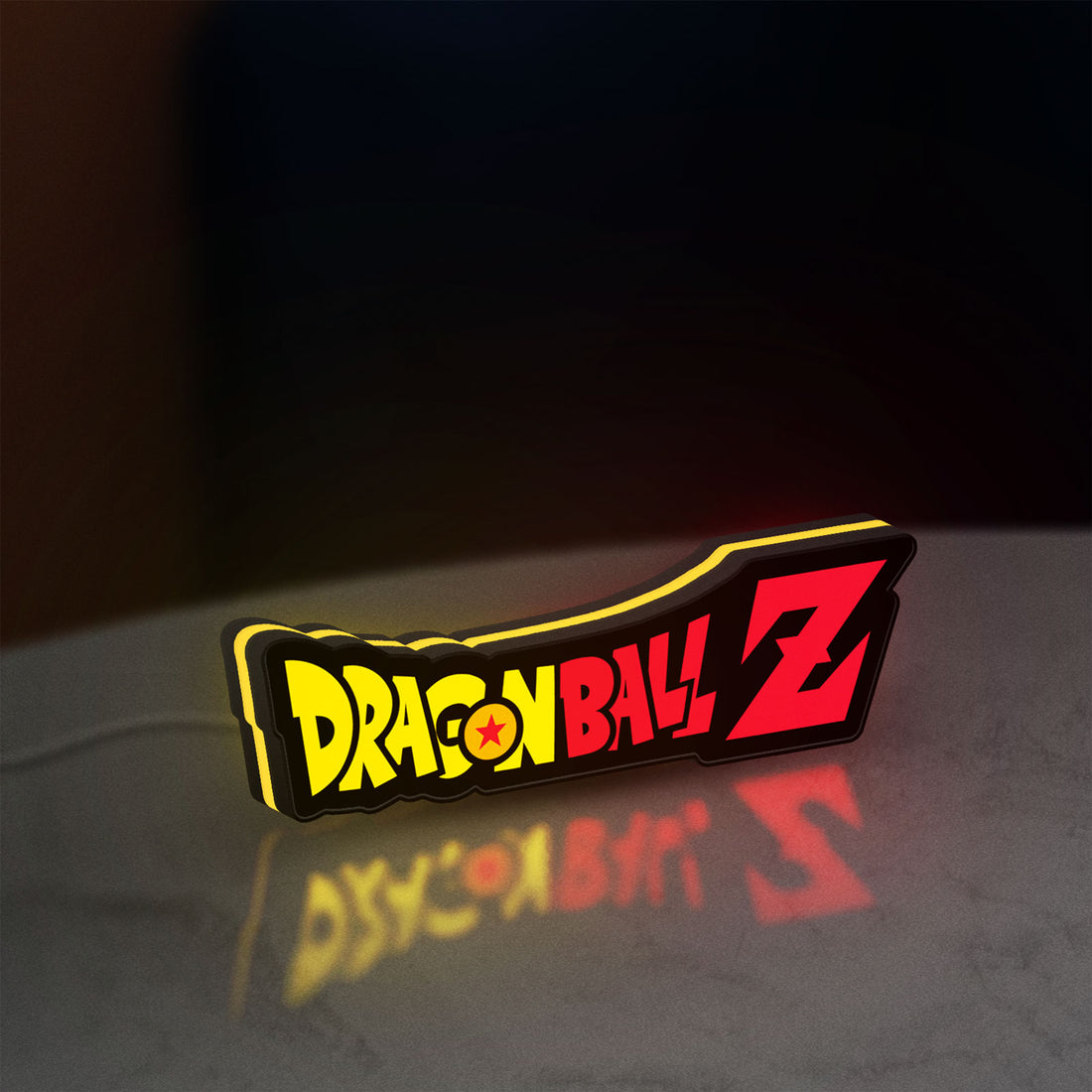 Dragon Ball Z LED lightbox hanging on a wall with yellow glow