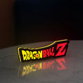 Dragon Ball Z LED lightbox standing on a desk from an angled side view with yellow glow