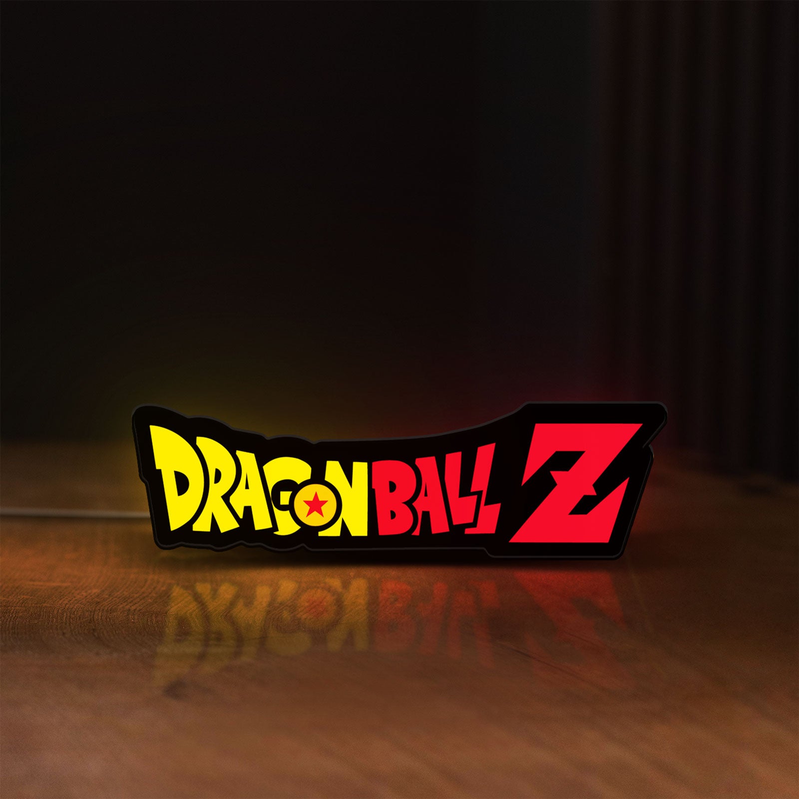 Front view of Dragon Ball Z LED lightbox sign glowing on a wooden desk