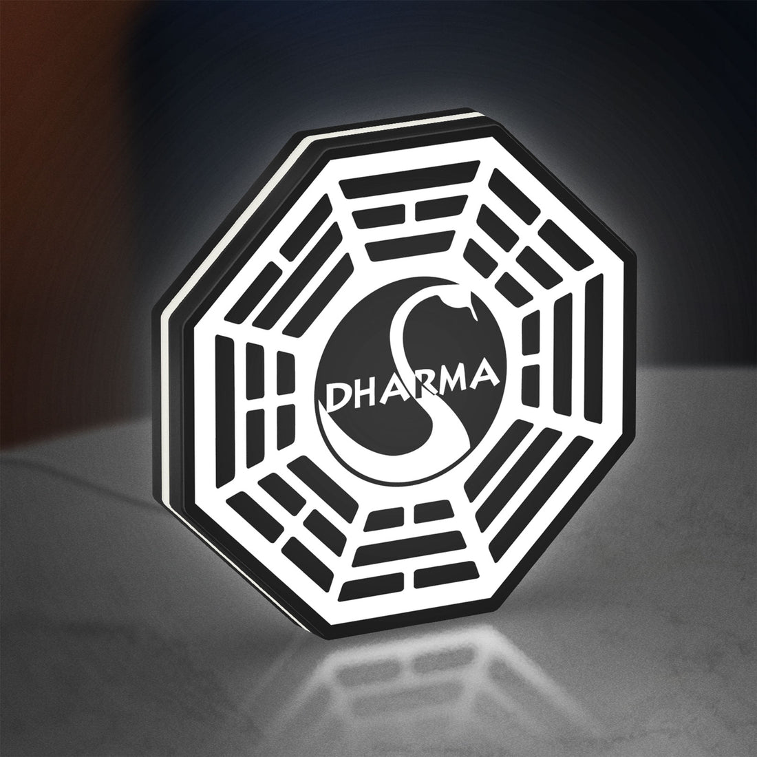 Dharma Initiative LED lightbox hanging on a wall with white glow