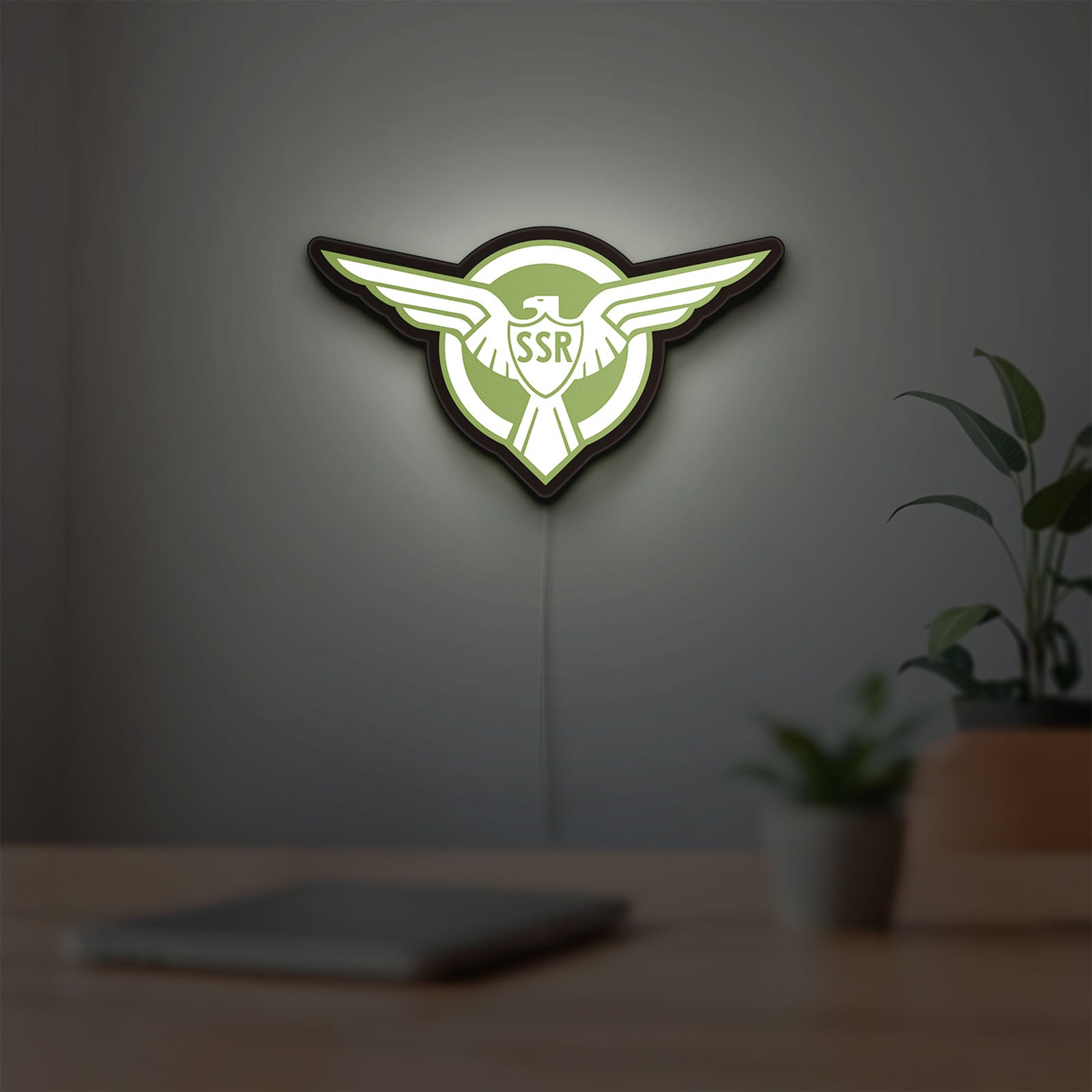 Captain America SSR LED lightbox hanging on a room wall with soft green light