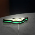 Captain America SSR LED lightbox lying flat on a desk with green glow