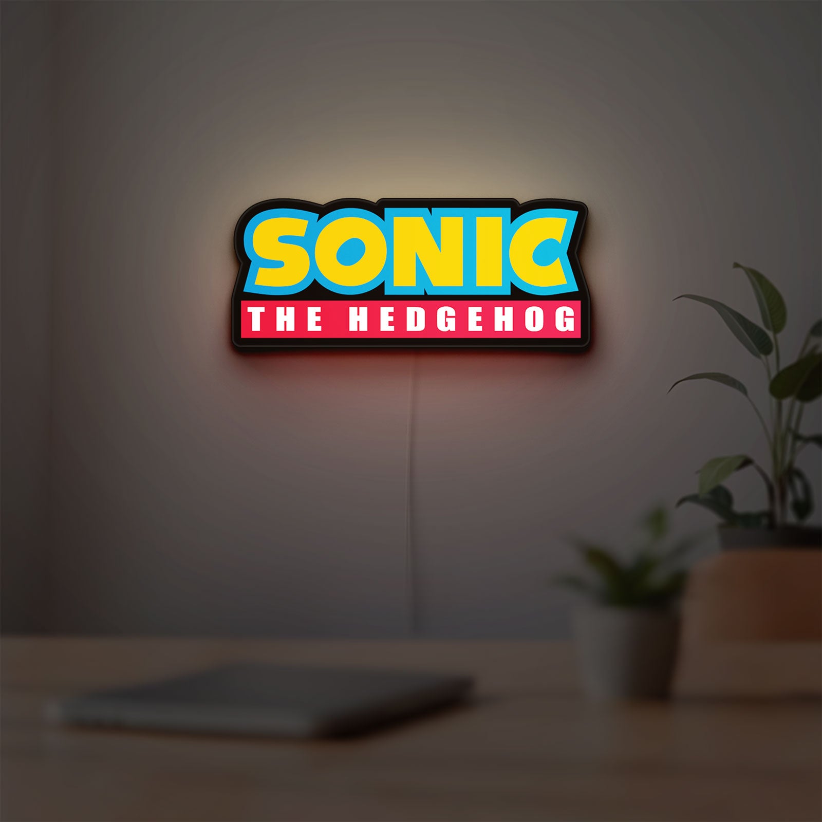 Sonic the Hedgehog LED lightbox hanging on a room wall with soft white light