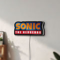 Unlit Sonic the Hedgehog LED lightbox mounted on a wall in daylight