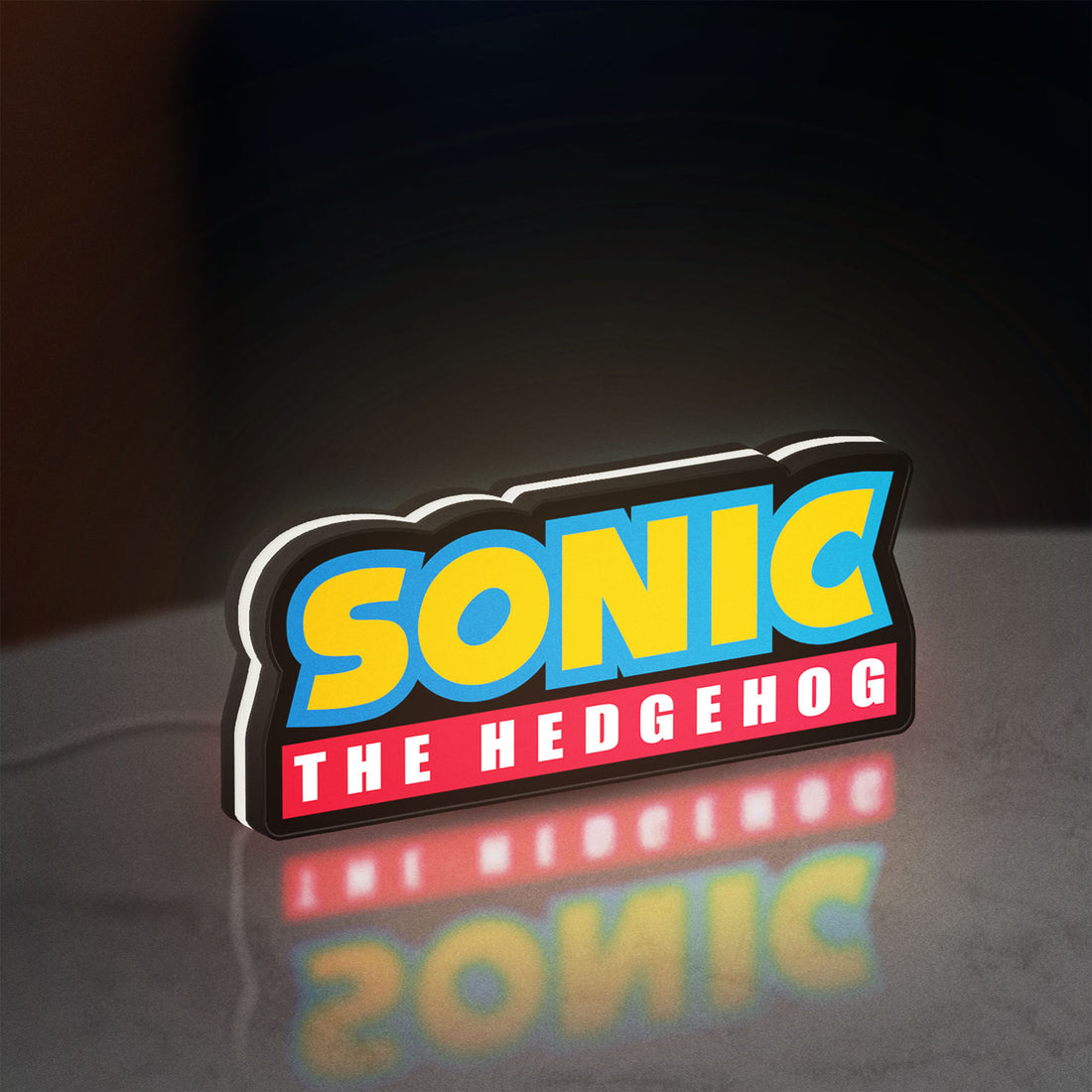 Sonic the Hedgehog LED lightbox hanging on a wall with white glow