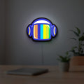 Retro Broadcast LED lightbox hanging on a room wall with soft blue light