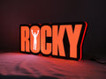 Illuminated angled view standing of Rocky Balboa 3D LED Sign in 40cm, perfect for music studio and bedroom decor