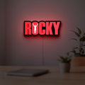 Rocky Balboa LED lightbox hanging on a room wall with soft red light
