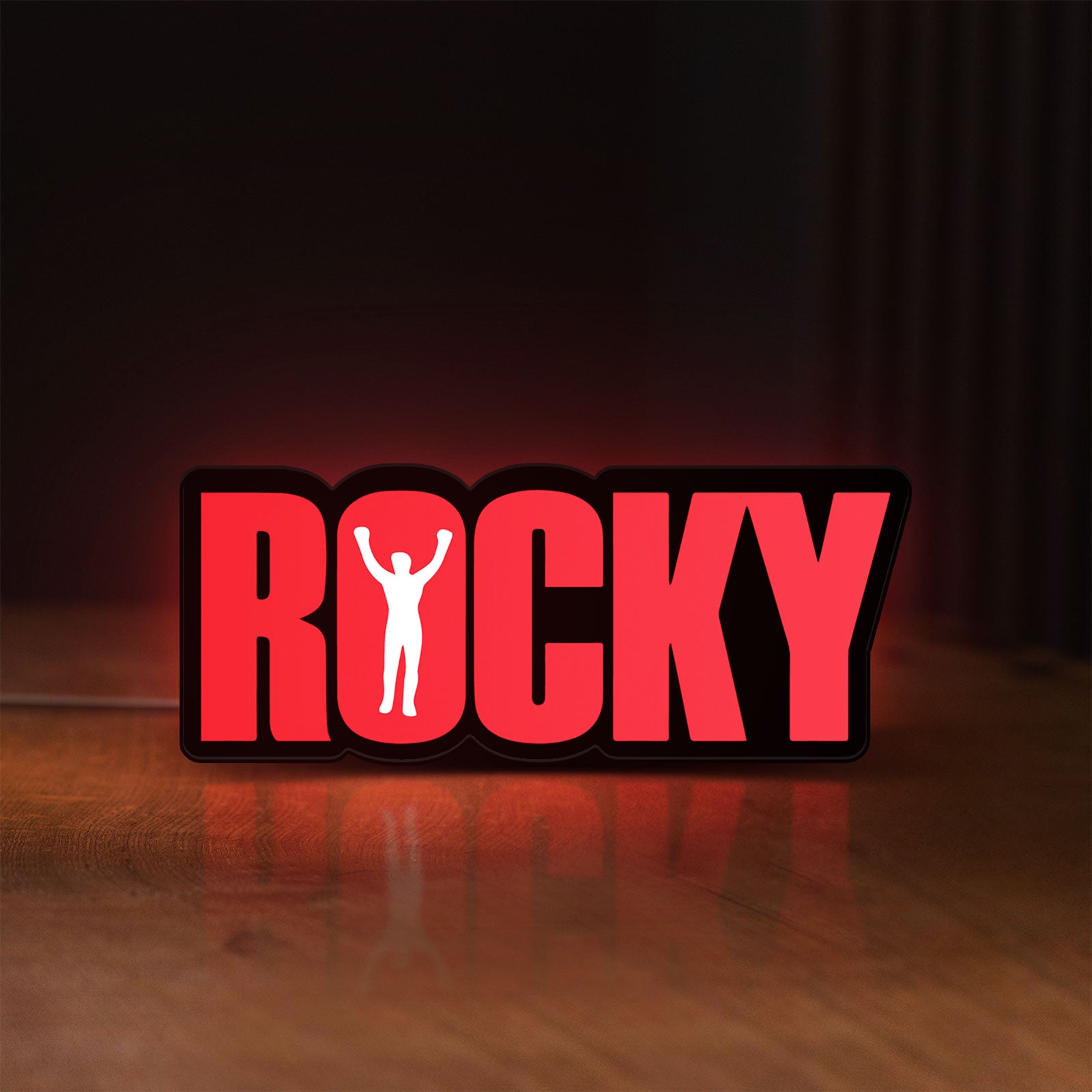 Front view of Rocky Balboa LED lightbox sign glowing on a wooden desk