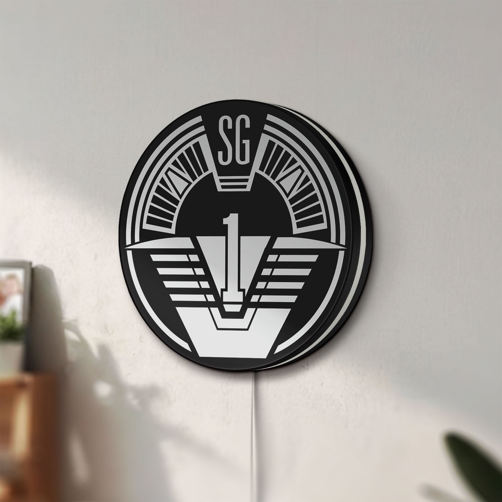 Unlit SG-1 Patch Lightbox LED lightbox mounted on a wall in daylight