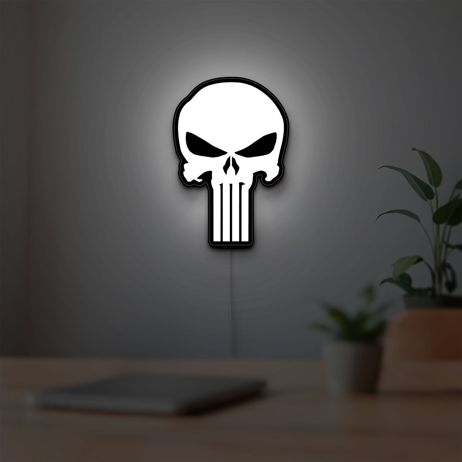 Punisher Skull LED lightbox hanging on a room wall with soft white light