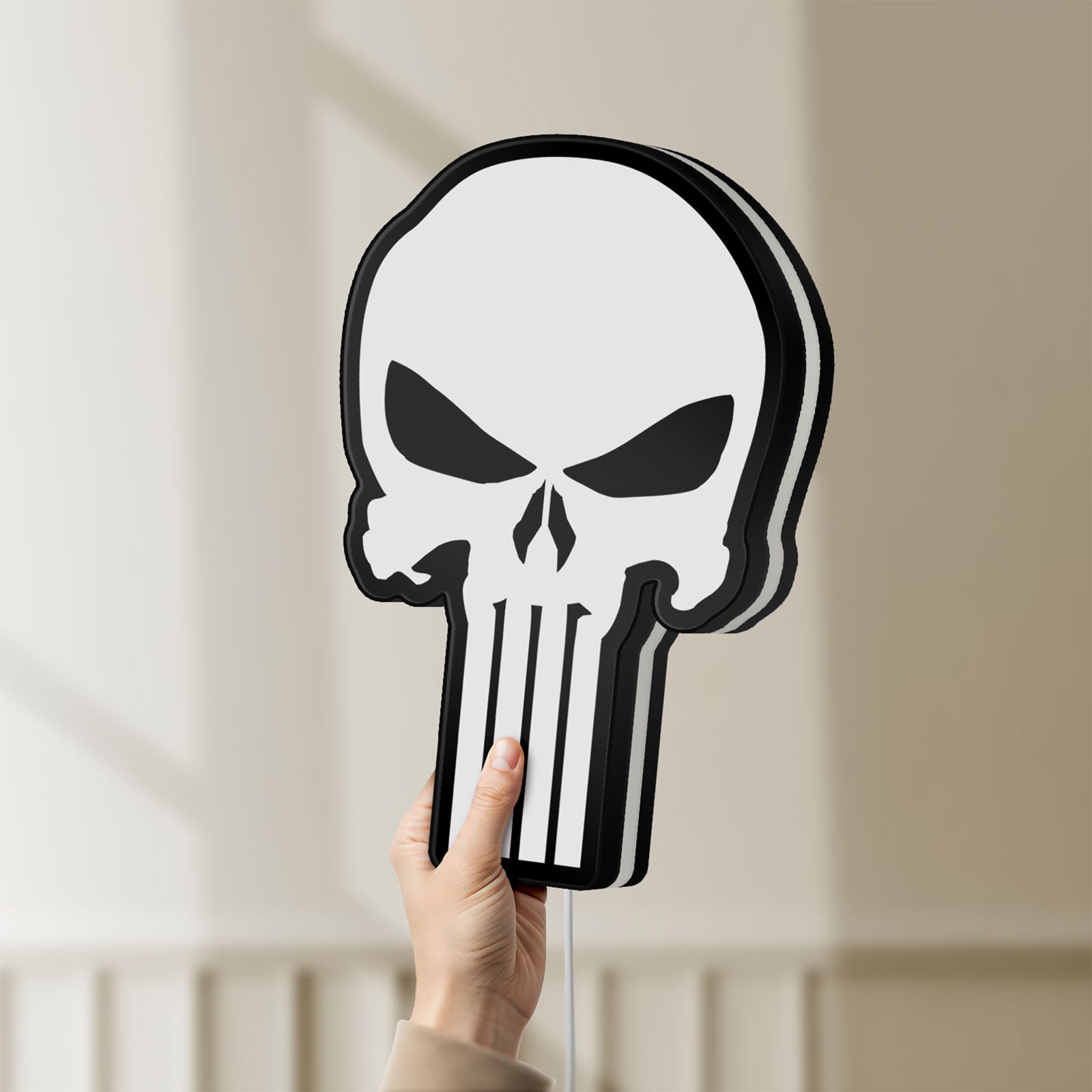 Unlit Punisher Skull LED lightbox held by hand to show size and details