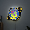Discovery Kids Space LED lightbox hanging on a wall with yellow glow